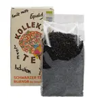Bunte Vorderseite der Papierverpackung mit Teeblättern in Cellophan