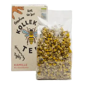 Bunte Vorderseite der Papierverpackung mit Teeblättern in Cellophan